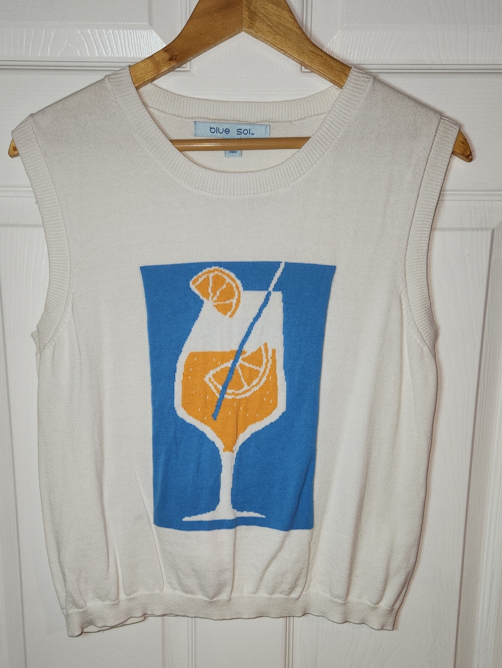 Blue Sol Cream Sleeveless Knit Top with Blue & Orange Drink Graphic